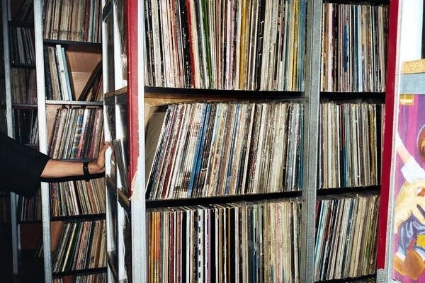 Shelves packed with vinyl records in an extensive music archive